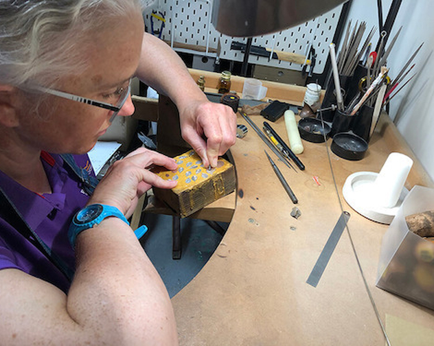 De Burca Design making Mary engraving silver leaves at workbench