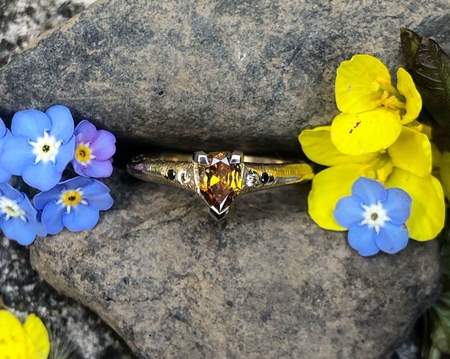 Sunburst orange diamond black diamond yellow gold engagement ring