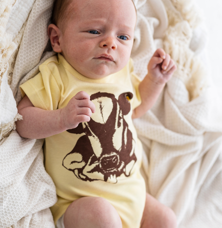 Baby bodysuit with calf print